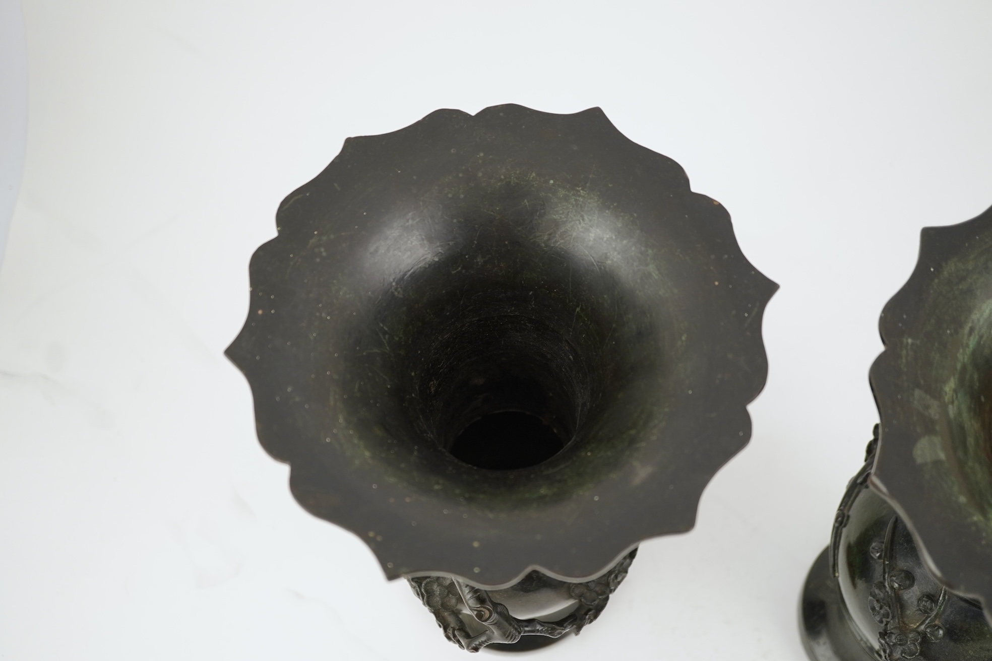 A pair of Chinese bronze gu-shaped vases, Qing dynasty